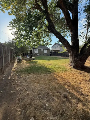 a bedroom with furniture and a flat screen tv