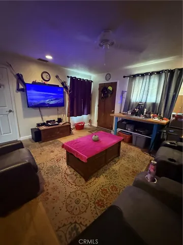 a kitchen with granite countertop a stove a sink and a microwave