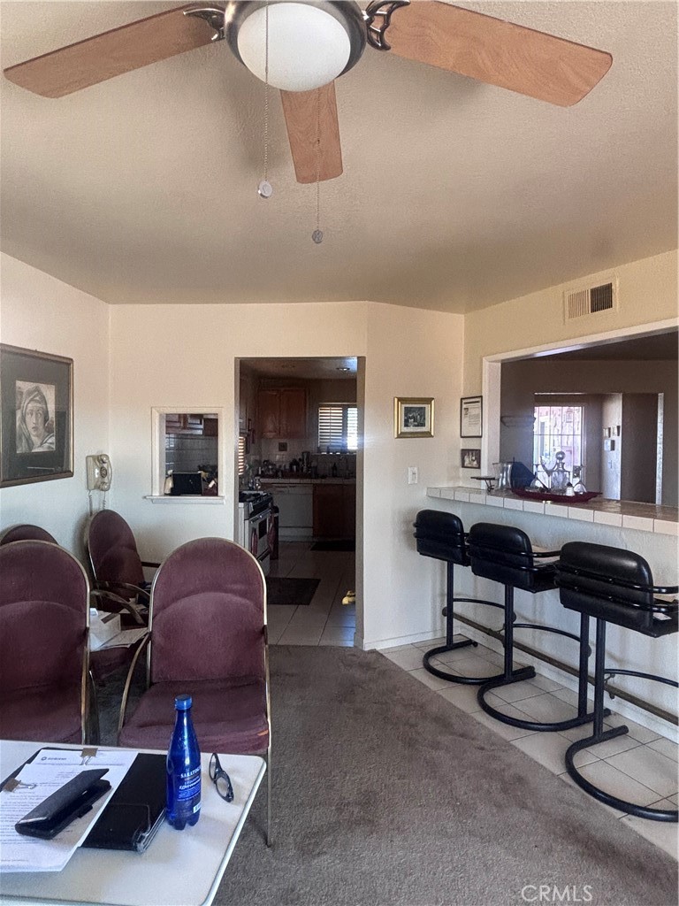 19221 Scobey Avenue Carson, CA 90746 - Photo 14 of 15 a living room with furniture and a flat screen tv