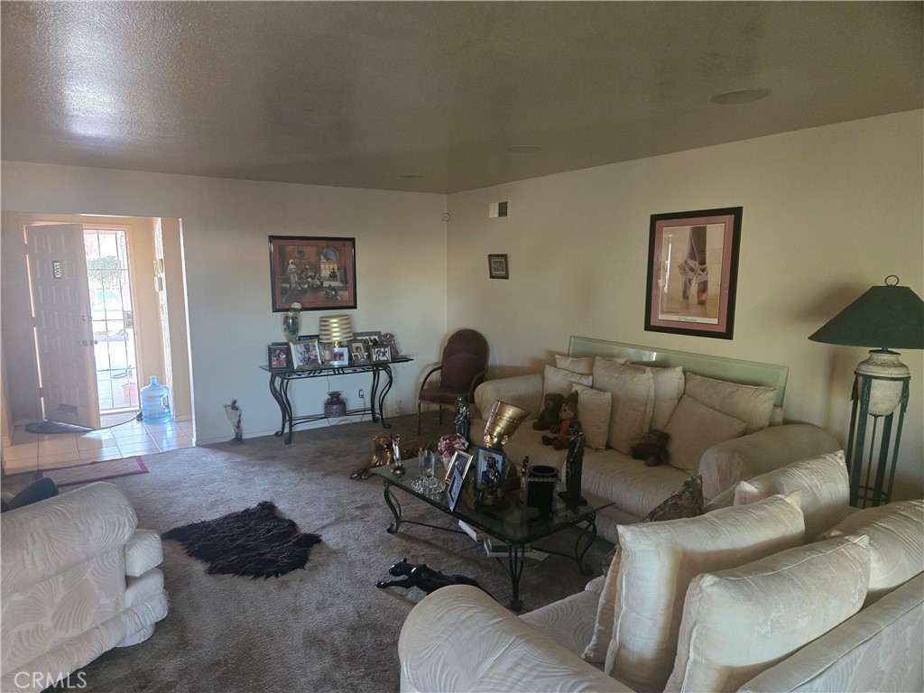 19221 Scobey Avenue Carson, CA 90746 - Photo 3 of 5 a living room with furniture