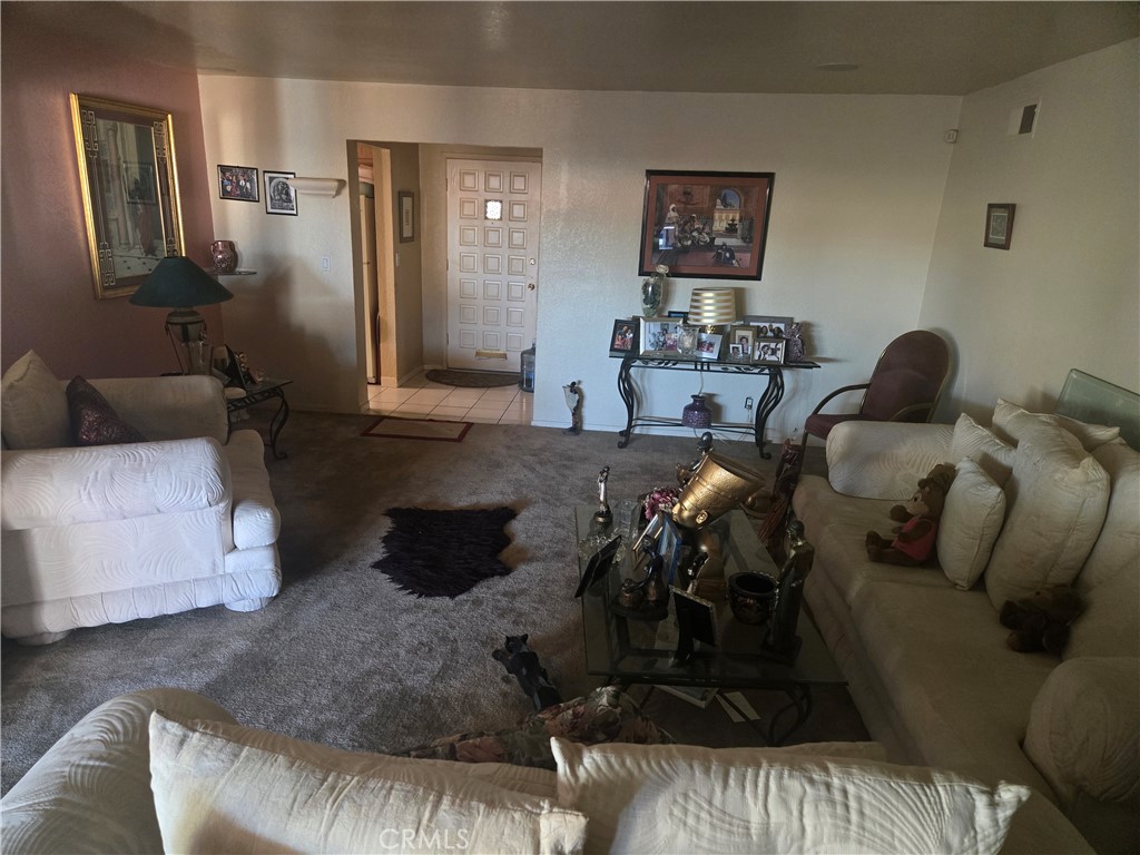 19221 Scobey Avenue Carson, CA 90746 - Photo 5 of 5 a living room with furniture and a couch