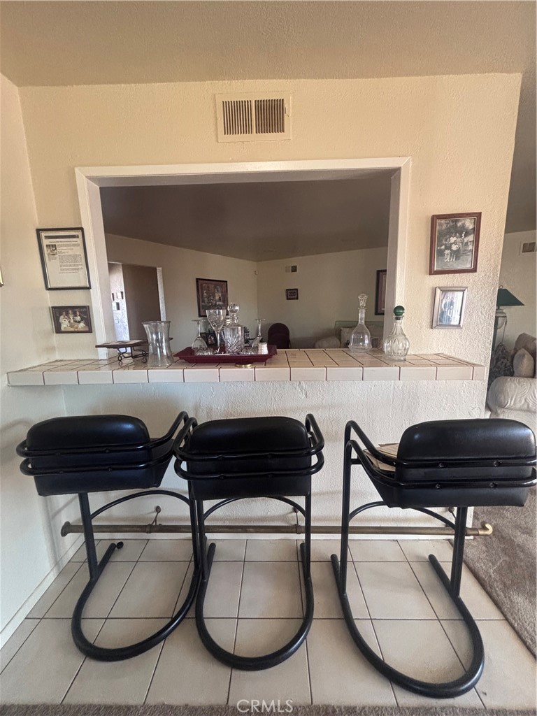 19221 Scobey Avenue Carson, CA 90746 - Photo 9 of 15 a living room with furniture and a table