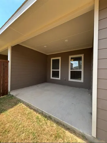 a view of swimming pool with an outdoor seating