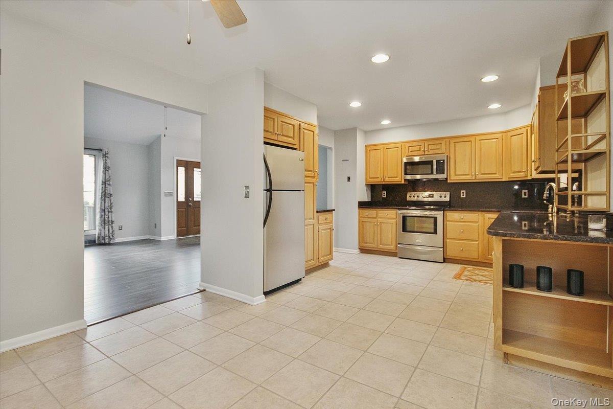 102 Old Post Road Marlboro, NY 12542 - Photo 18 of 46 a kitchen with granite countertop a refrigerator and a stove top oven