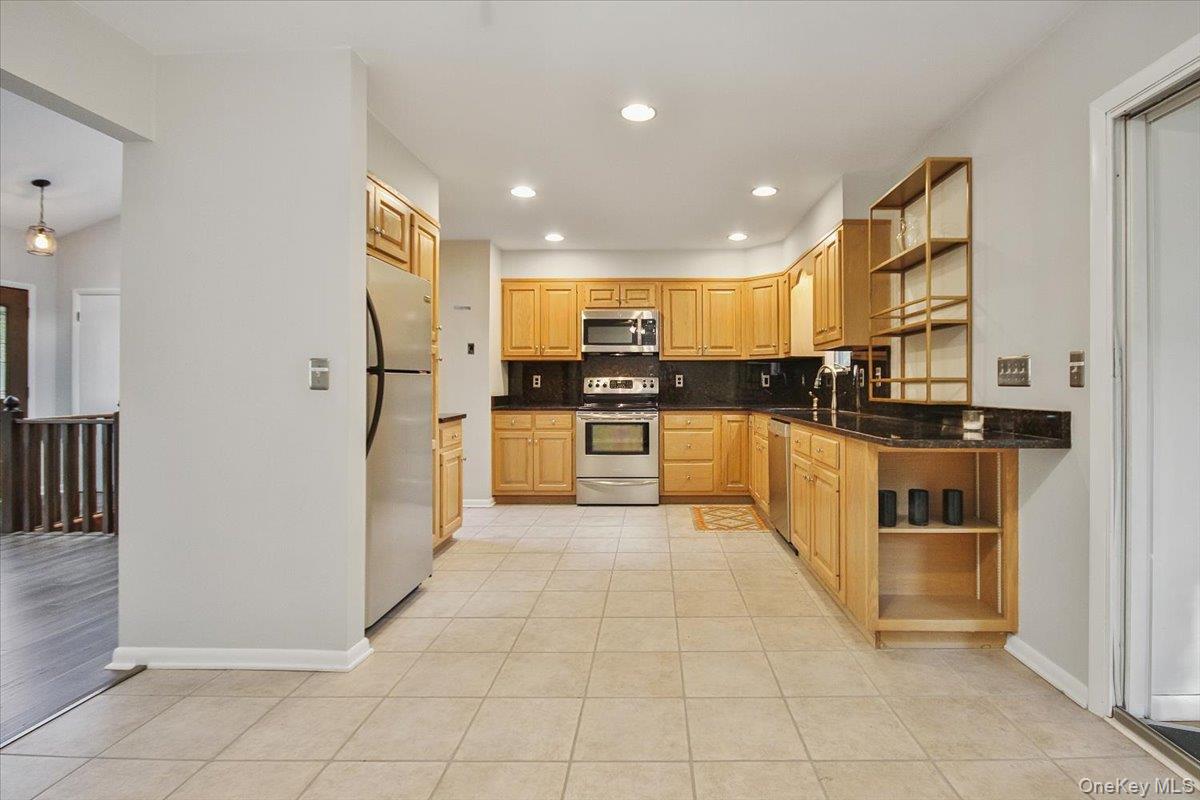 102 Old Post Road Marlboro, NY 12542 - Photo 19 of 46 a kitchen with stainless steel appliances granite countertop a refrigerator and a stove