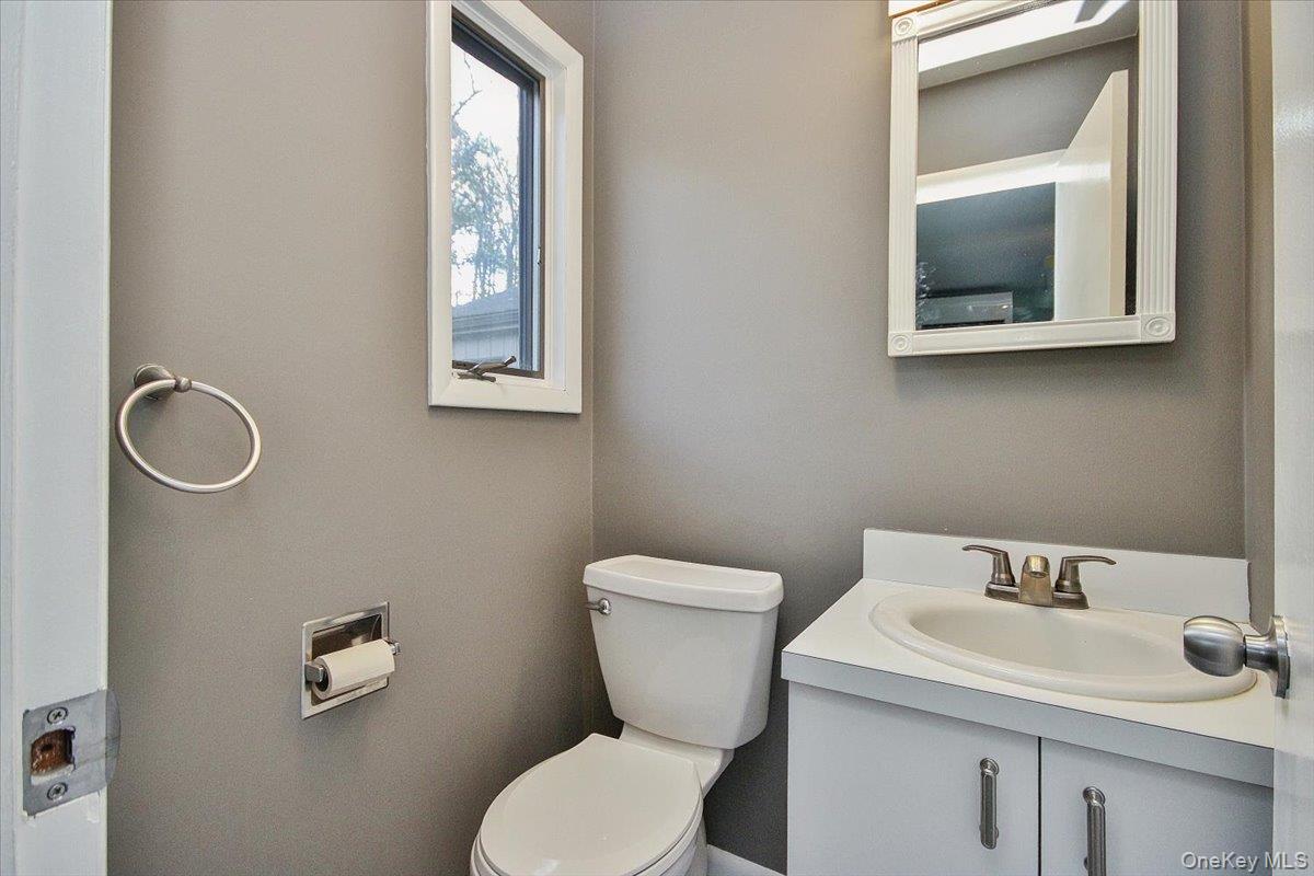 102 Old Post Road Marlboro, NY 12542 - Photo 30 of 46 a bathroom with a toilet sink and mirror