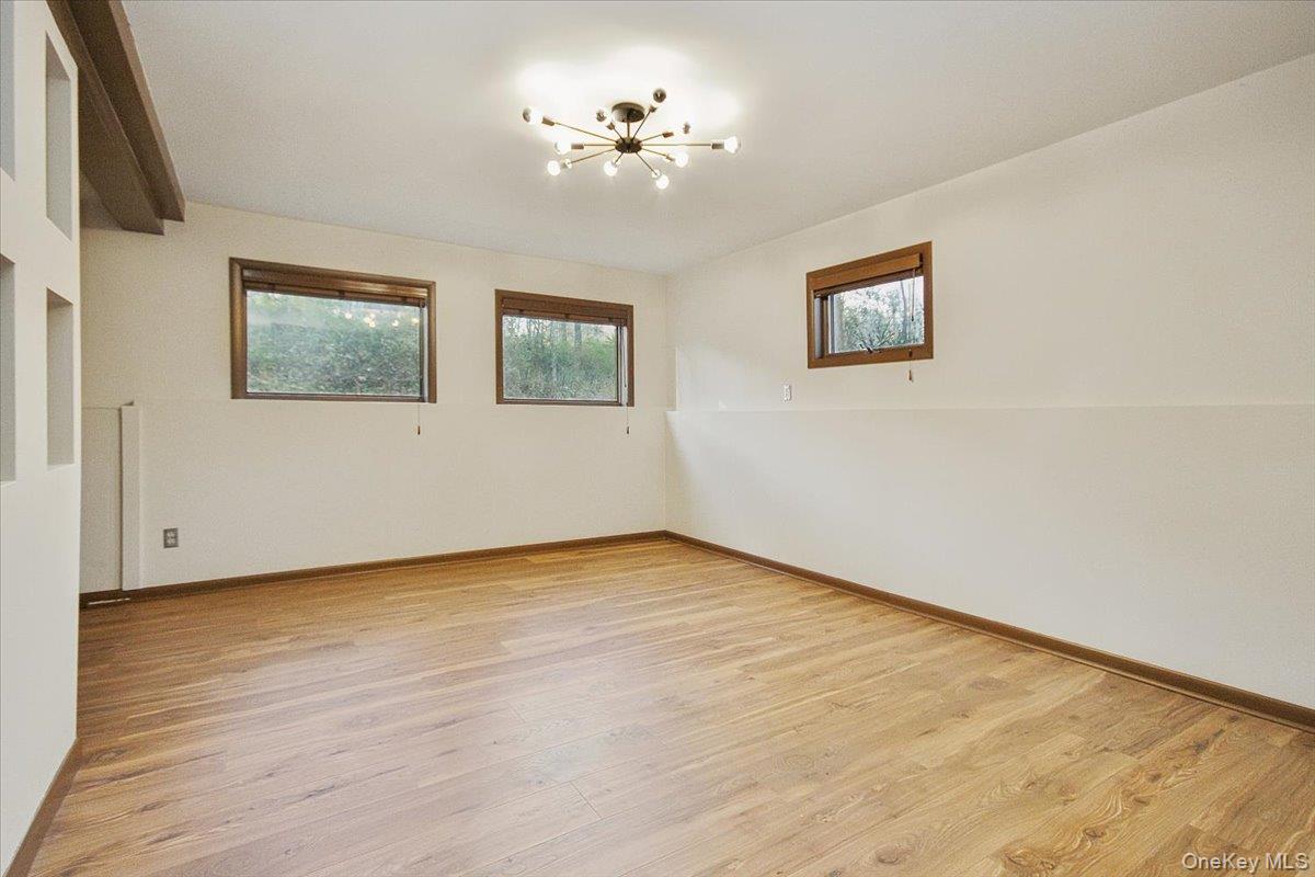 102 Old Post Road Marlboro, NY 12542 - Photo 36 of 46 a view of an empty room with a painting on the wall