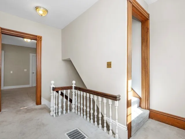a view of a hallway with windows