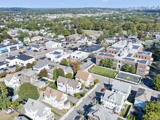 an aerial view of a city with lots of residential buildings