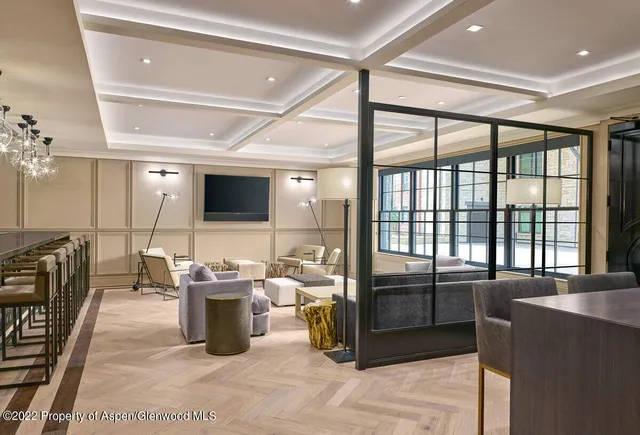 a living room with lots of furniture and a flat screen tv