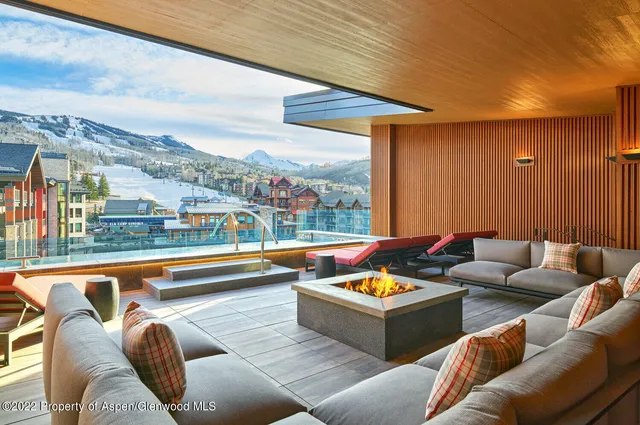 a outdoor living space with furniture and city view