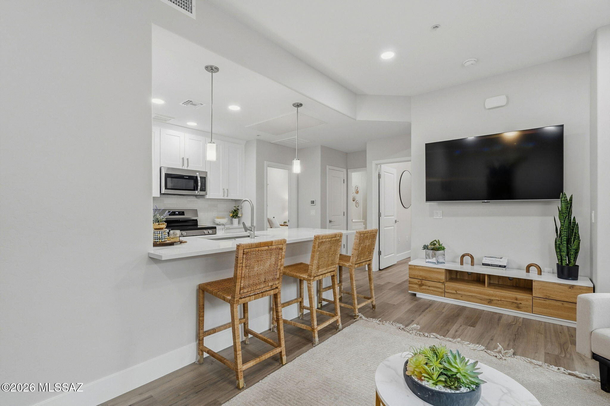 2022 East River Road, Unit 102 Tucson, AZ 85718 - Photo 21 of 21 Breakfast Bar & Media Wall