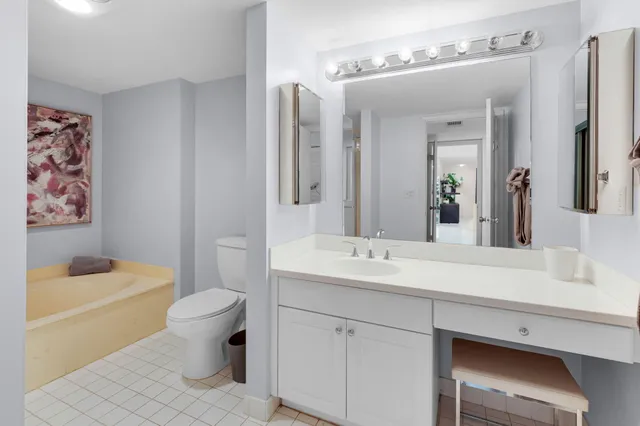 a bathroom with a sink toilet a mirror and shower