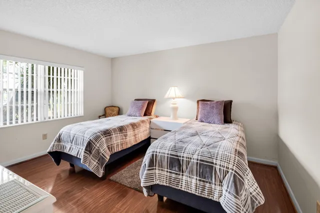 a bedroom with bed and a window