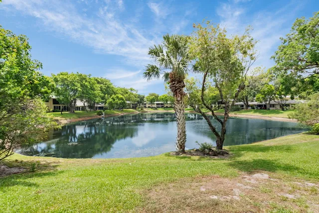 a view of a lake with a house in the background