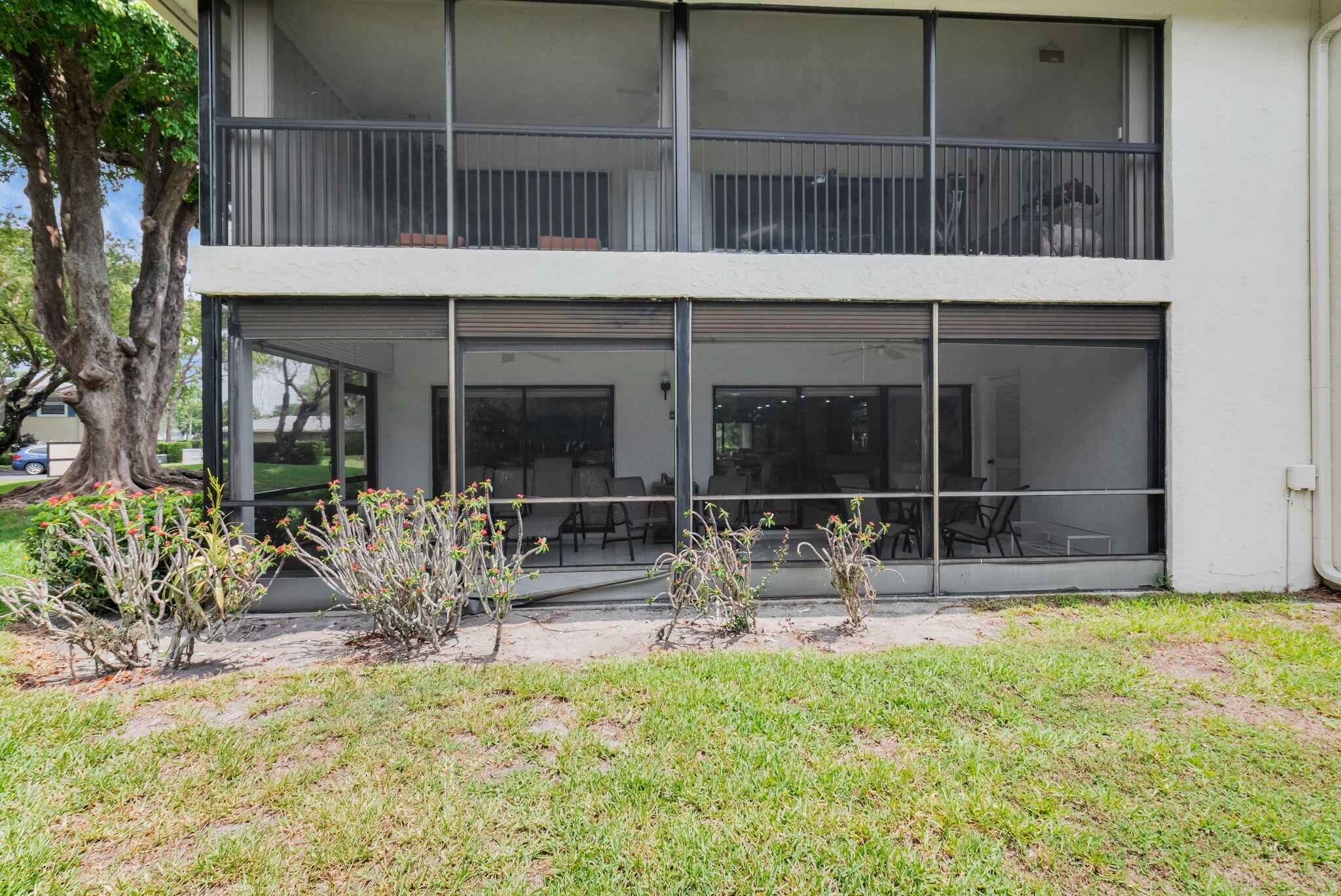 12 Westgate Lane, Unit C Boynton Beach, FL 33436 - Photo 35 of 54 a house view with a outdoor space