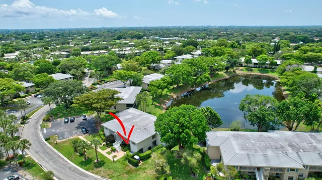 an aerial view of residential house with outdoor space and lake view
