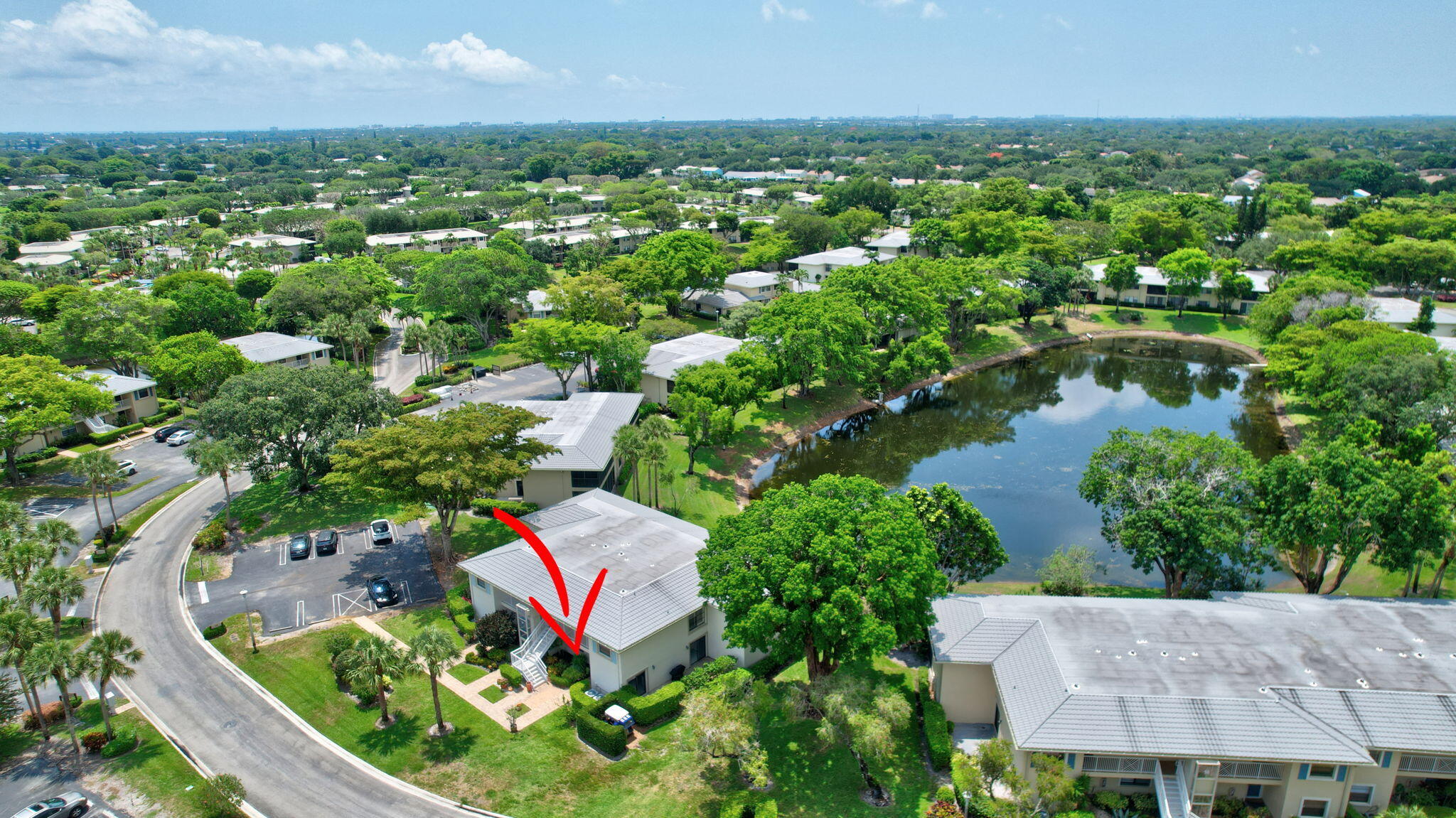 12 Westgate Lane, Unit C Boynton Beach, FL 33436 - Photo 39 of 54 an aerial view of residential house with outdoor space and lake view