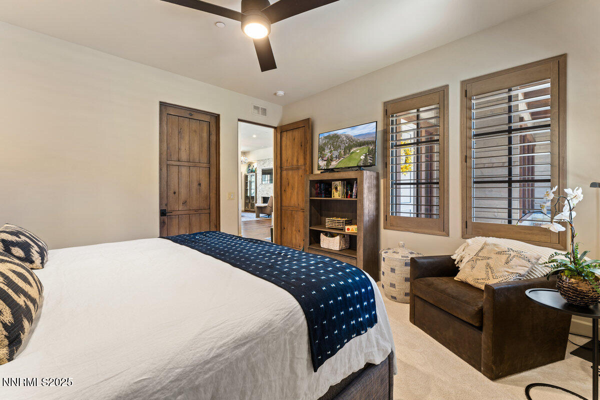253 Mill Race Loop Carson City, NV 89705 - Photo 14 of 44 a bedroom with a bed couch and a large window