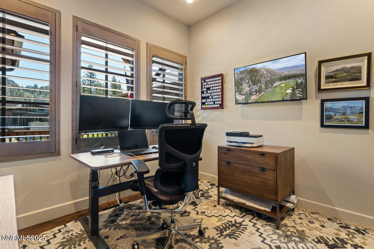 253 Mill Race Loop Carson City, NV 89705 - Photo 15 of 44 a view of a workspace with furniture and a window
