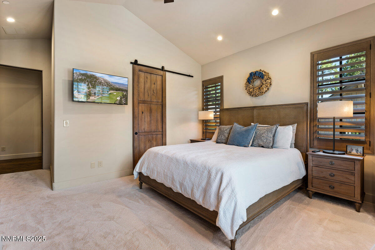 253 Mill Race Loop Carson City, NV 89705 - Photo 16 of 44 a bedroom with a bed and painting on the wall