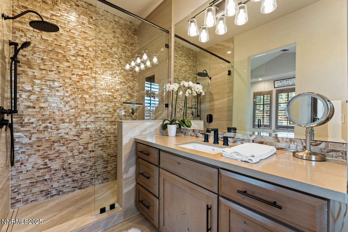 253 Mill Race Loop Carson City, NV 89705 - Photo 17 of 44 a bathroom with a sink and a mirror
