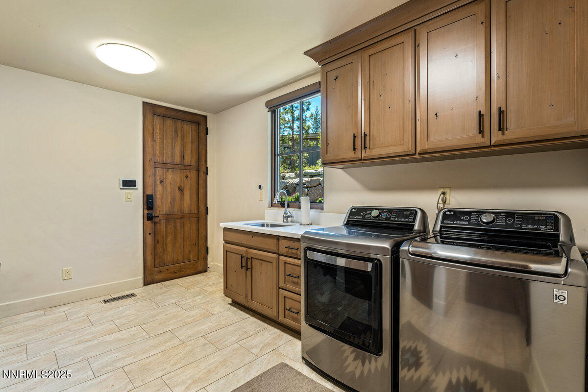 253 Mill Race Loop Carson City, NV 89705 - Photo 18 of 44 a kitchen with stainless steel appliances granite countertop a stove and a refrigerator