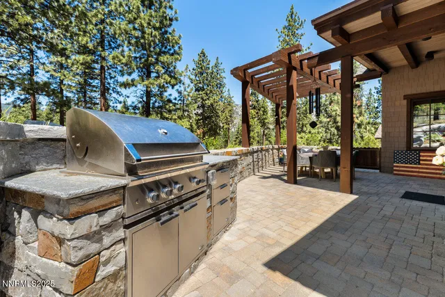 a backyard of a house with outdoor seating