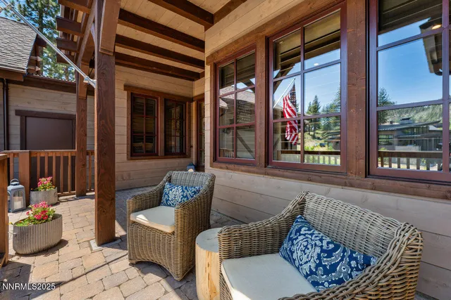 a building outdoor space with patio furniture and potted plants