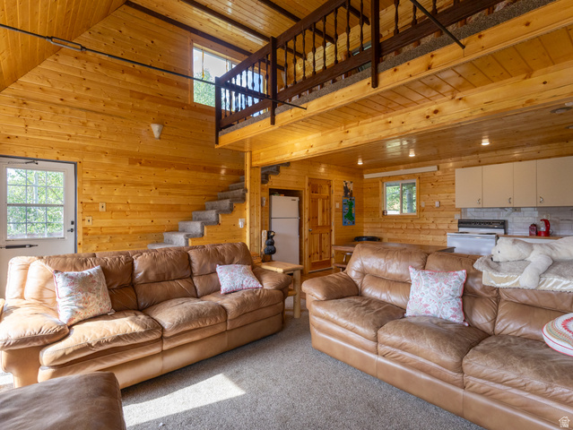 4770 Pine Crest Road Evanston, UT 82930 - Photo 12 of 24 Open-concept living space with extensive wood paneling throughout