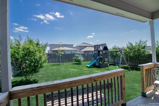 a view of a porch and a yard