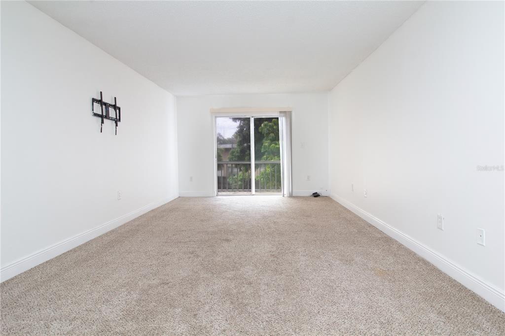 389 South McMullen Booth Road, Unit 12 Clearwater, FL 33759 - Photo 10 of 25 an empty room with windows