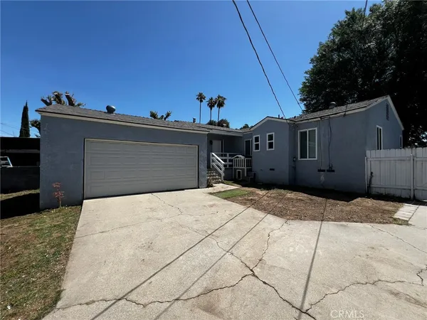 a front view of a house with a garage