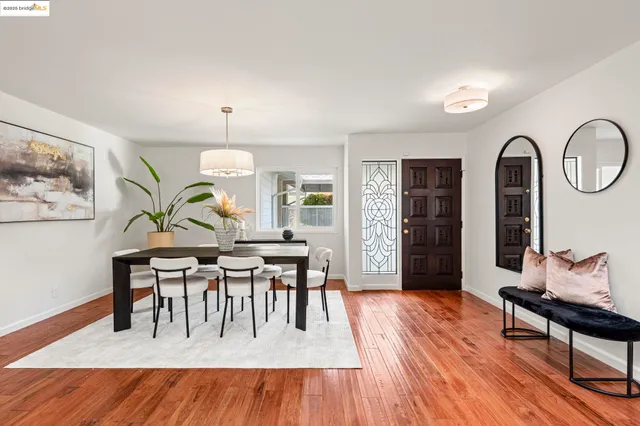 a view of a dining room with furniture window and wooden floor