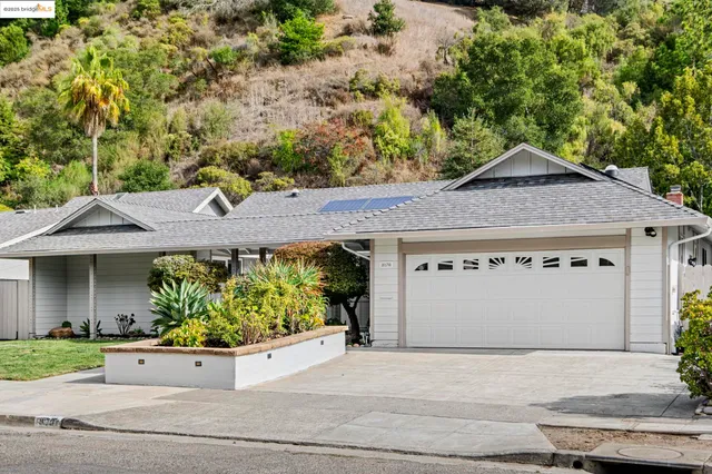 front view of a house with a bench