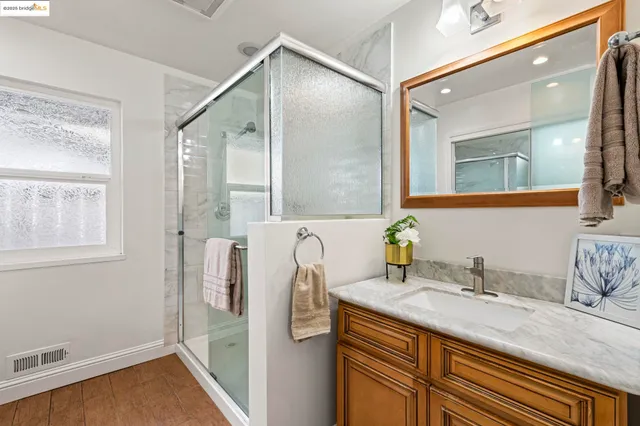 a view of a porch with furniture and garden