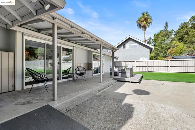 swimming pool view with a seating space