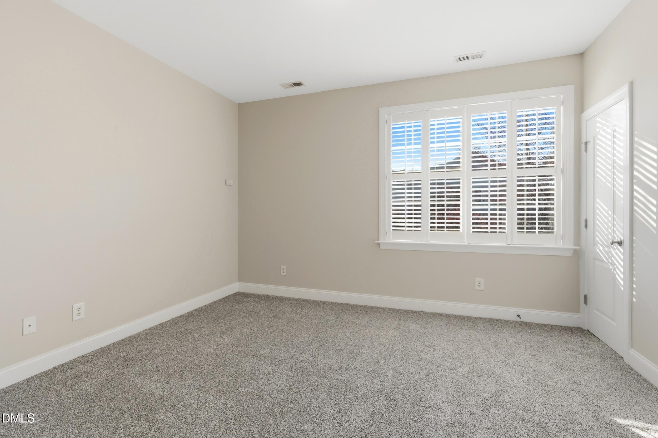 4803 Marena Place Durham, NC 27707 - Photo 26 of 42 an empty room with a window