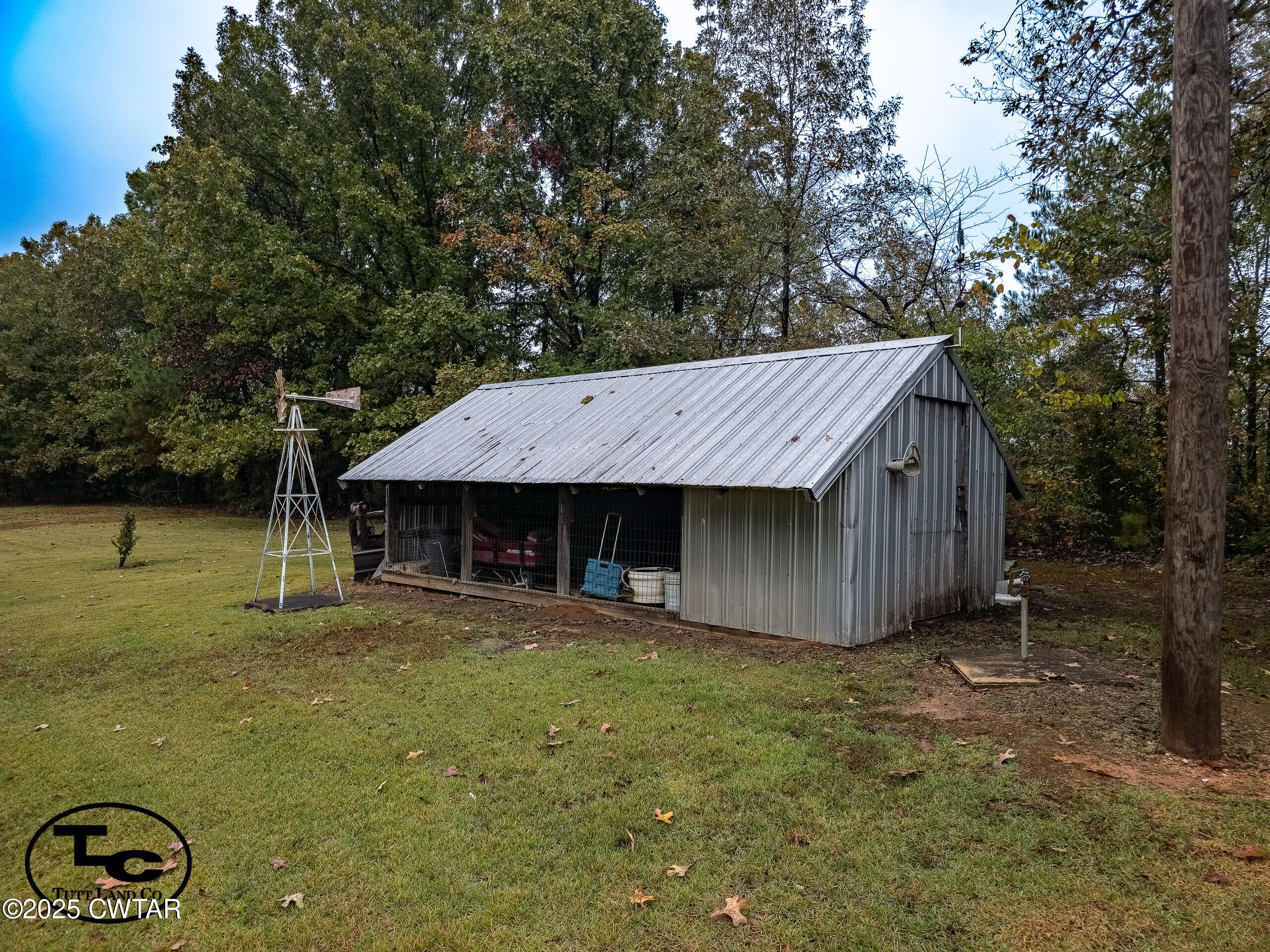 3964 Center Hill Road Finger, TN 38334 - Photo 15 of 31 a wooden house with trees in front of it