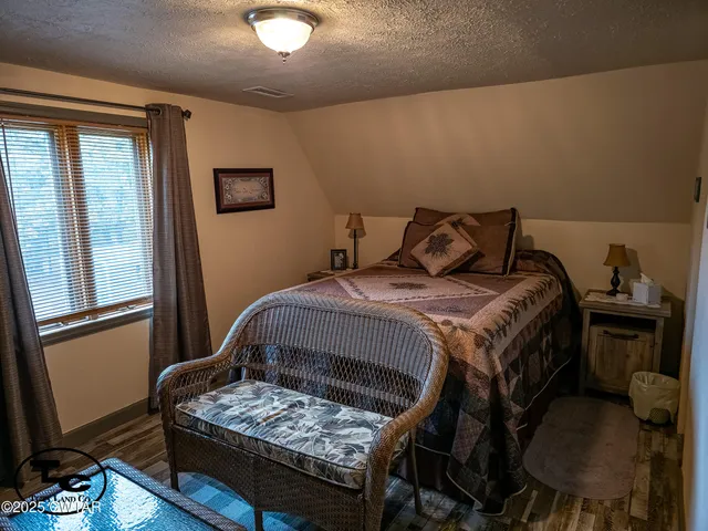 a view of hall way with furniture and staircase