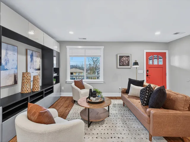 a living room with furniture and a large window