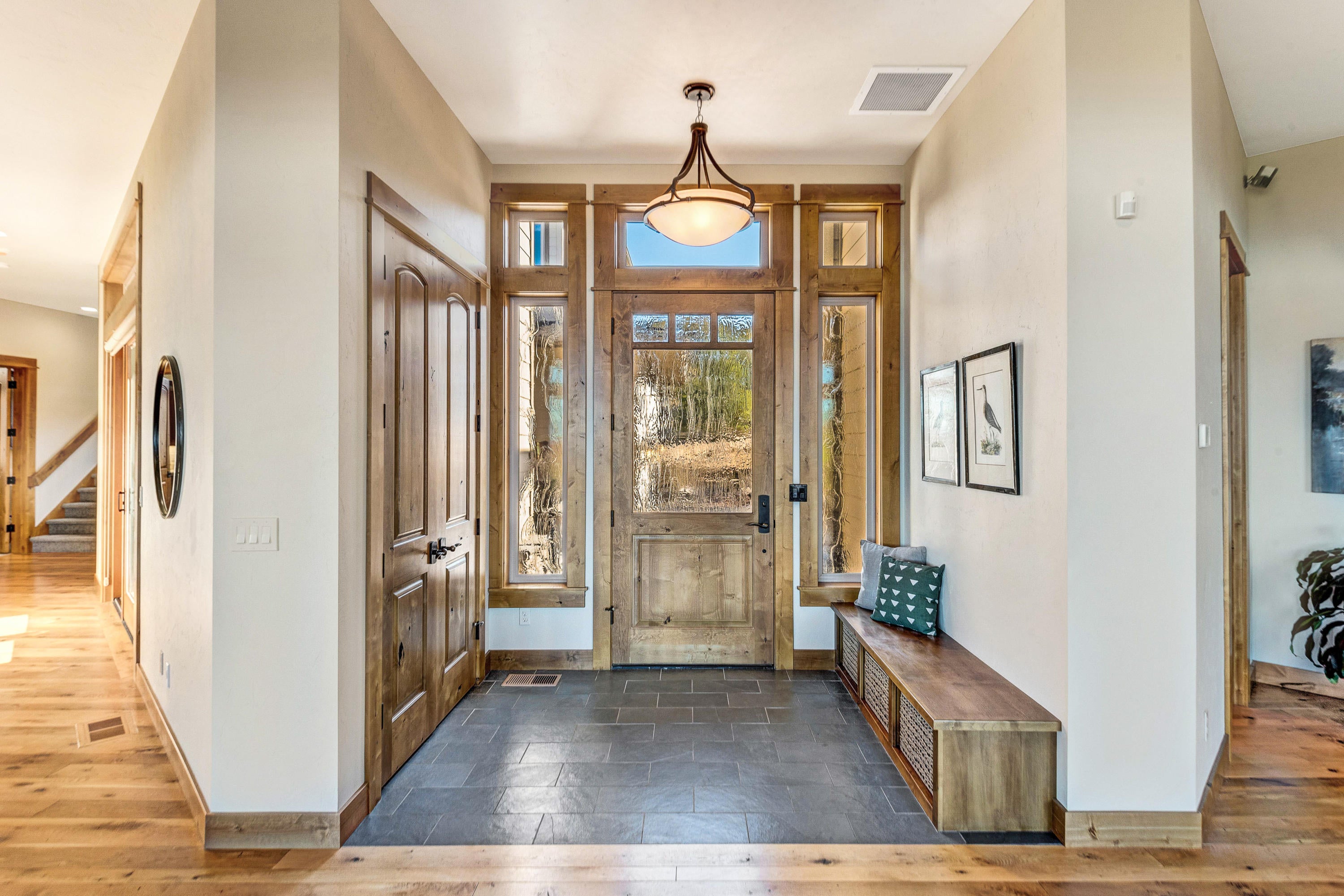 1133 Highland View Loop Redmond, OR 97756 - Photo 8 of 59 Front door with textured glass, bench and coat closet