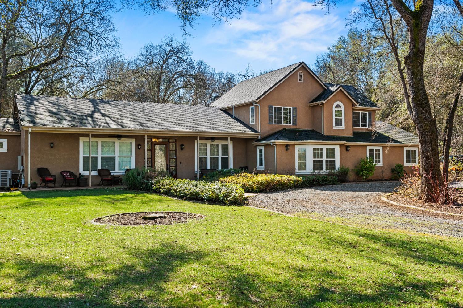 2661 Oak Ln Drive Rescue, CA 95672 - Photo 2 of 69 a front view of a house with yard and green space