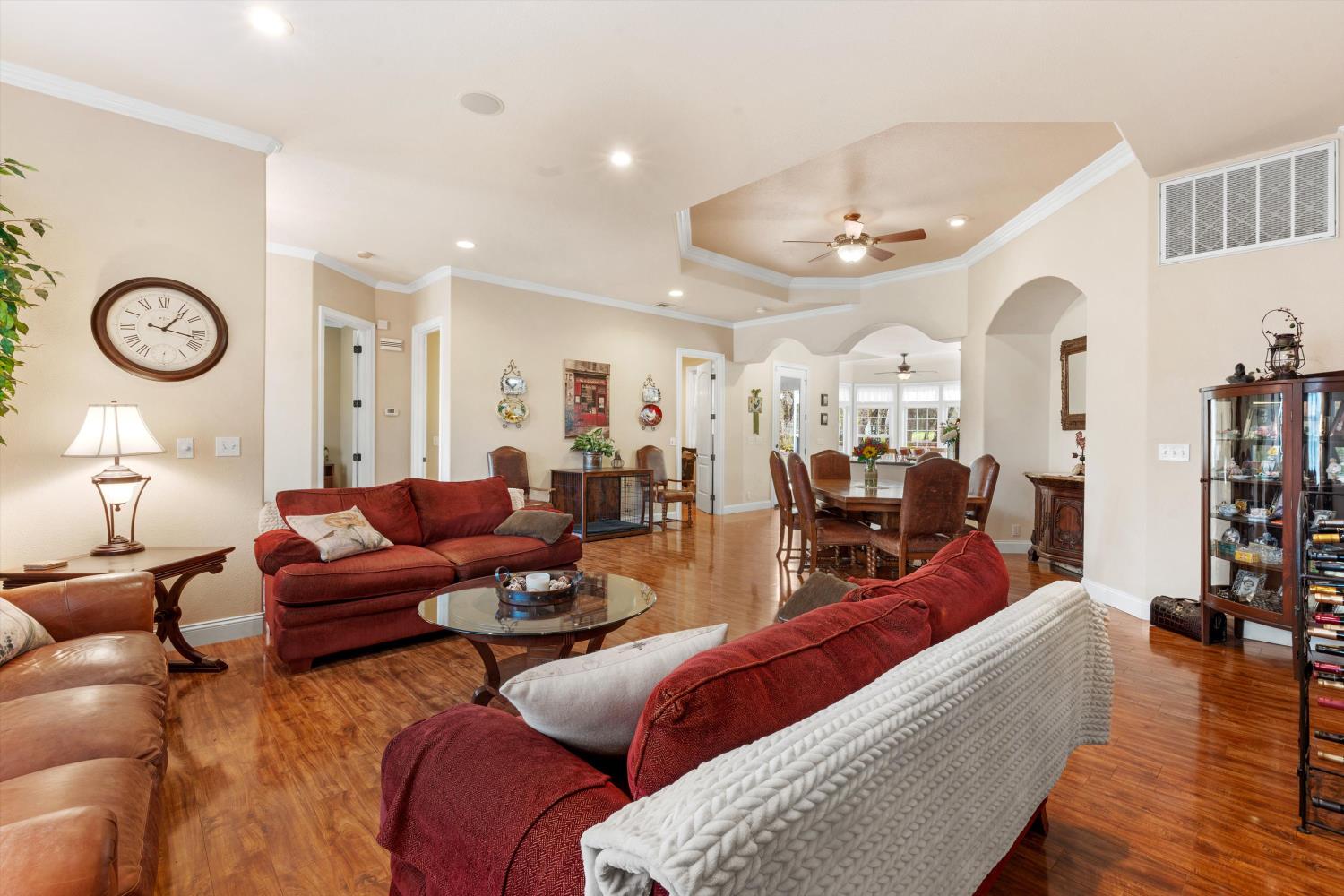 2661 Oak Ln Drive Rescue, CA 95672 - Photo 22 of 69 a living room with furniture a clock and wooden floor