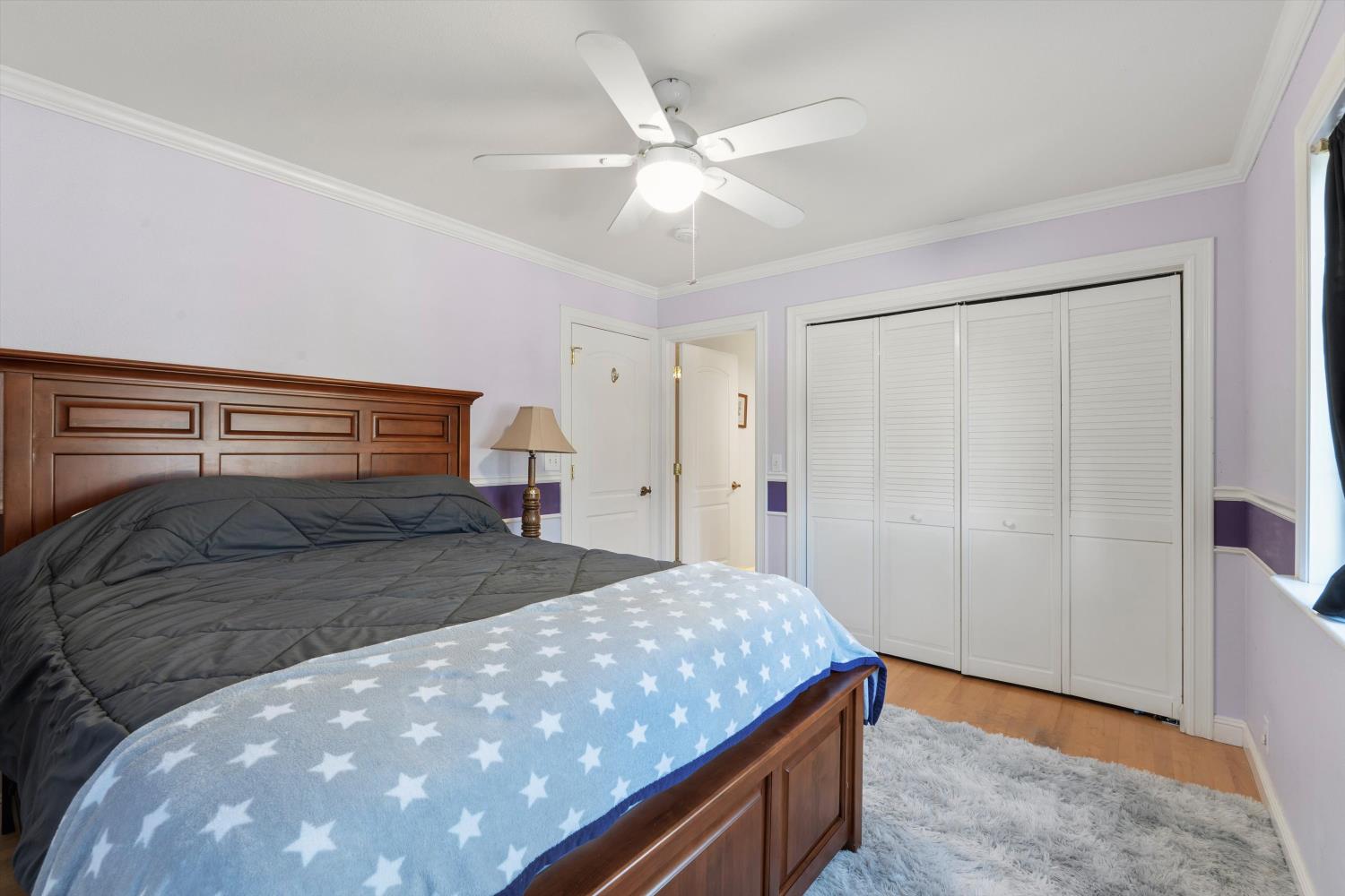 2661 Oak Ln Drive Rescue, CA 95672 - Photo 28 of 69 a bedroom with a bed and a ceiling fan