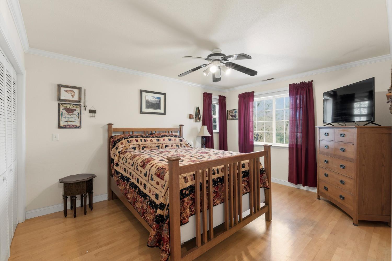 2661 Oak Ln Drive Rescue, CA 95672 - Photo 31 of 69 a bedroom with a bed and a chandelier