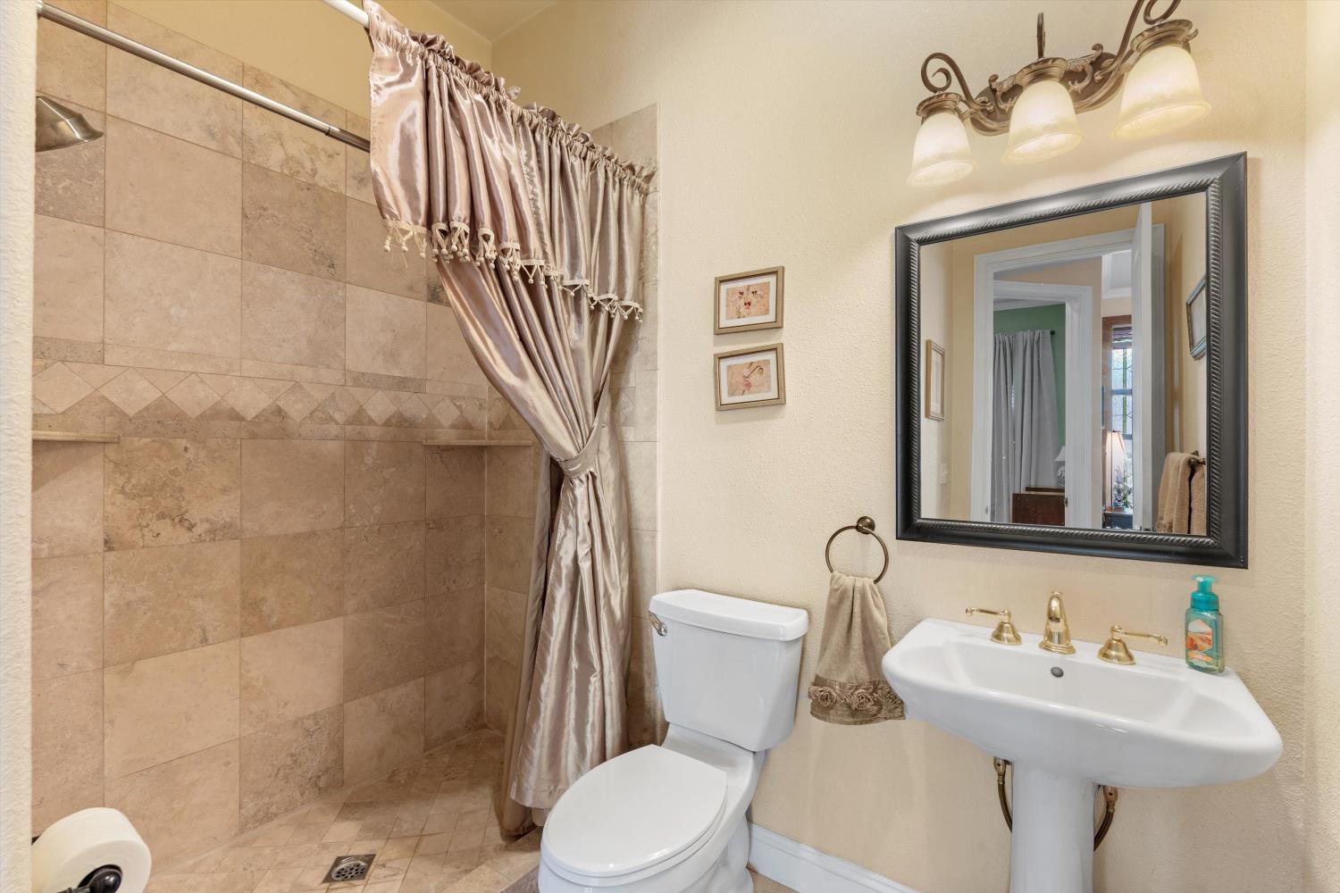 2661 Oak Ln Drive Rescue, CA 95672 - Photo 37 of 69 a bathroom with a sink toilet and shower