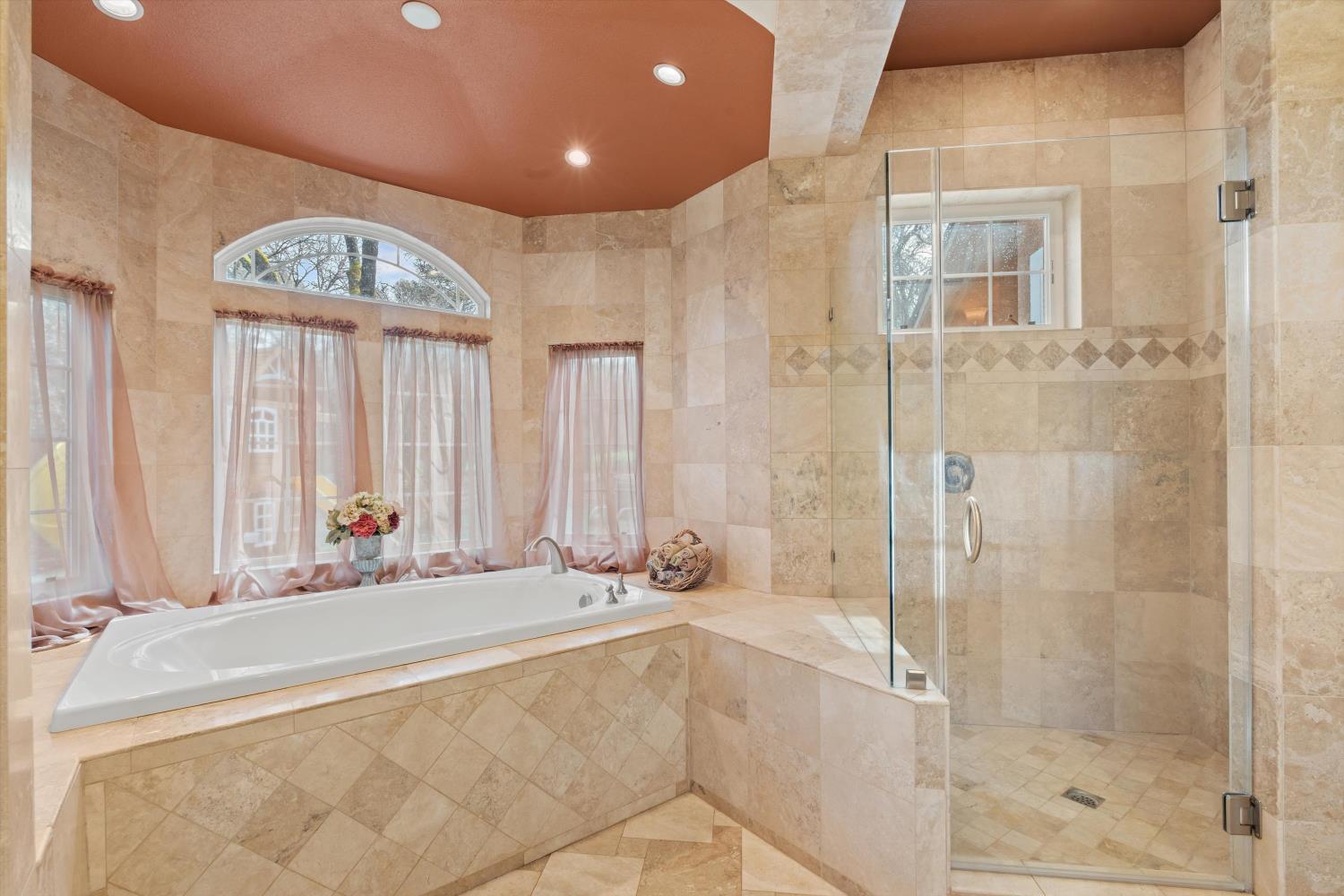 2661 Oak Ln Drive Rescue, CA 95672 - Photo 42 of 69 a bathroom with a bathtub and a shower