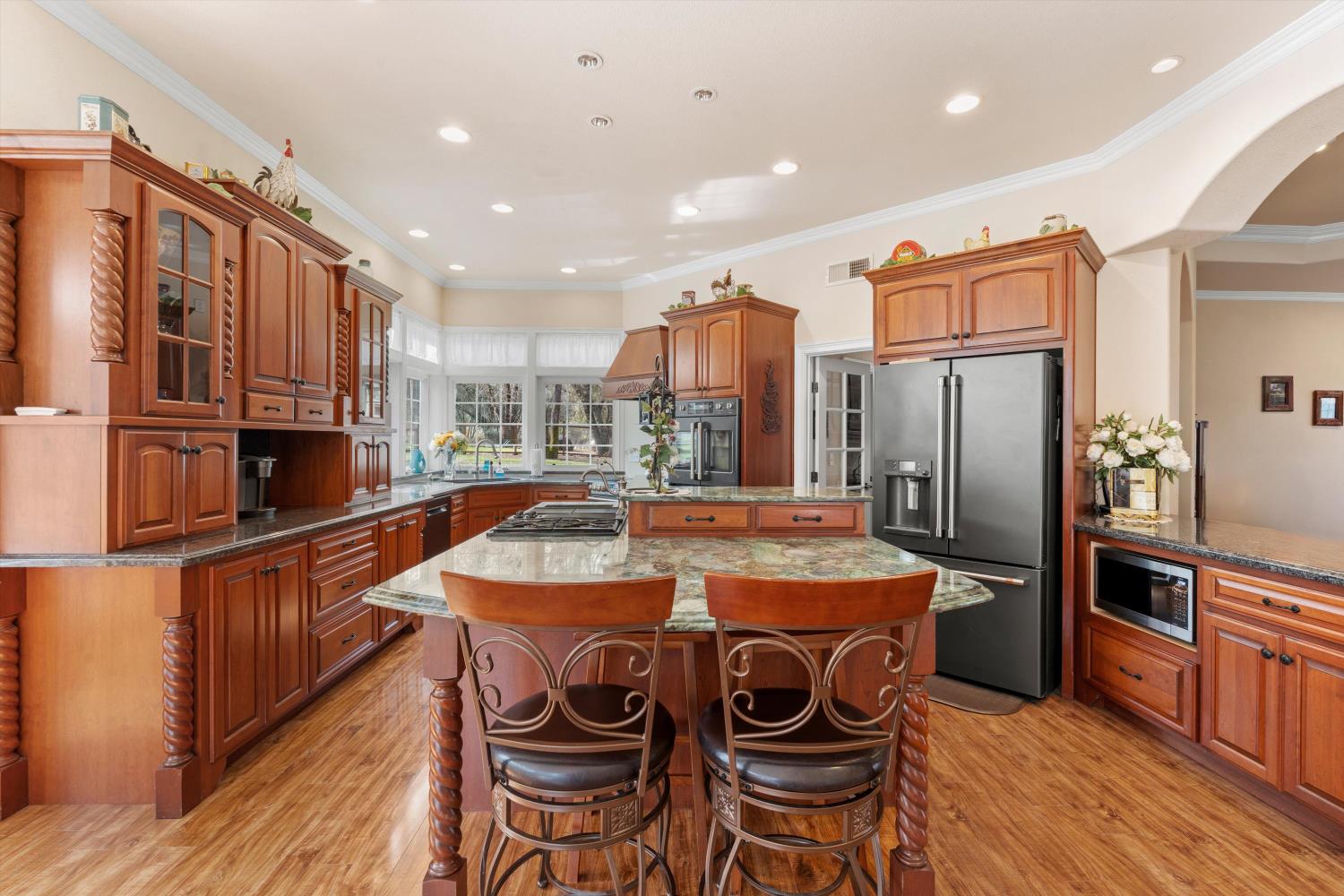 2661 Oak Ln Drive Rescue, CA 95672 - Photo 10 of 69 a kitchen with stainless steel appliances granite countertop a sink a stove and a refrigerator