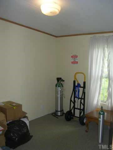 153 Stoney Mountain Road Rougemont, NC 27572 - Photo 12 of 12 a room with toys and a window